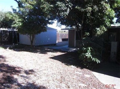 Large storage shed with access from driveway.