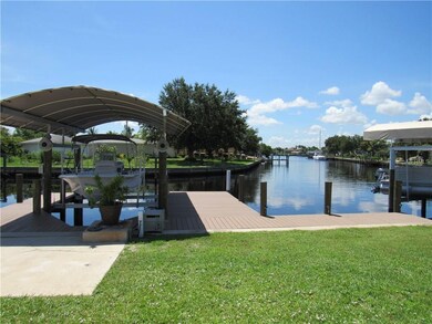 view of boat lift, dock, and water