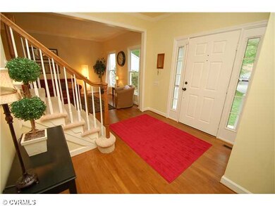 Foyer - Formal entry flows into the living and din