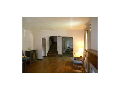View from living room into the center hall and din