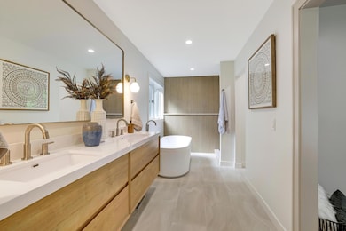 Soak up this spa-esque owner's suite bathroom with floating dual vanity sinks, designer fixtures and ceramic and tons of space! It's the mark of excellence....