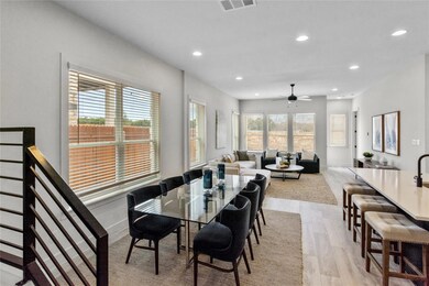 Dining area with recessed lighting, light wood fi