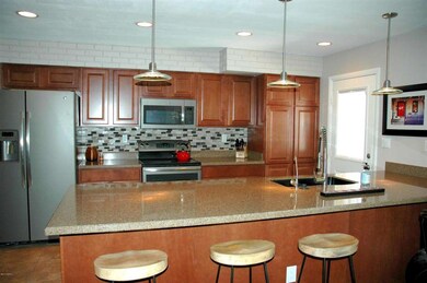 Kitchen with counter space for stools