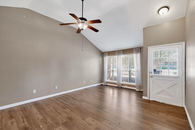 open family room with wood laminate floors