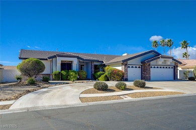 Ranch-style home featuring concrete driveway and a