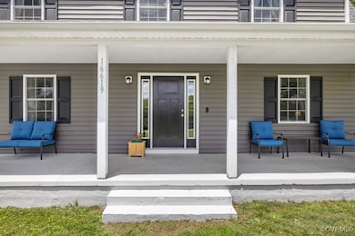 Entrance to property featuring a porch and a balco