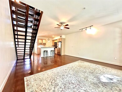 Another view of the large living area with ceiling