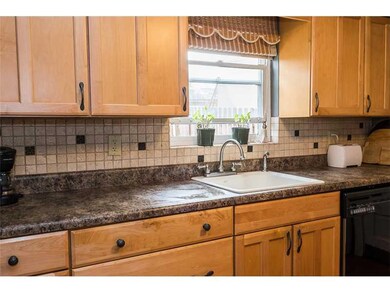 Kitchen. Kitchen has ceramic tile backsplash!