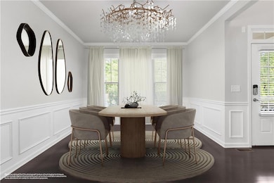 Dining area featuring dark wood-type flooring, a chandelier, wainscoting, crown molding, and breakfast area