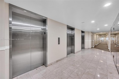 Three elevator banks offering quick service to parking, amenities and  floors.