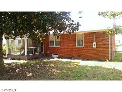 Exterior Back - A fenced and shady rear yard.  Not