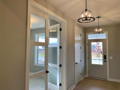 Double doors off foyer to main floor flex room.