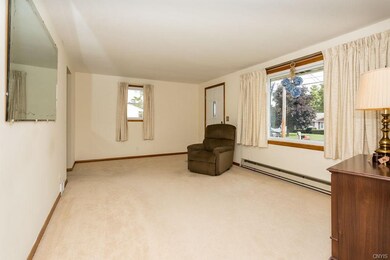 View of living room from hallway to entrance and k