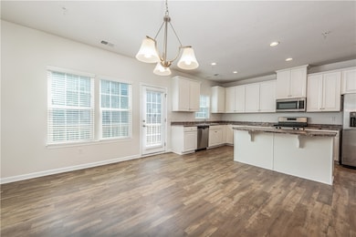 Great natural light to the front and back of this unit.  Walk right out to your balcony with your morning coffee from the dining room.