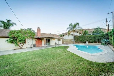 Backyard with pool and covered patio