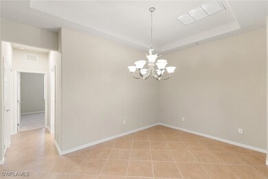 Unfurnished room featuring light tile patterned fl