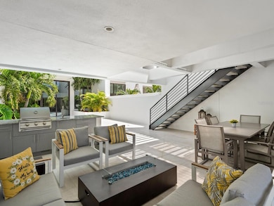 The stylish retreat offers a relaxation lifestyle with alfresco summer kitchen and fire pit, and Florida's quintessential outdoor lifestyle.