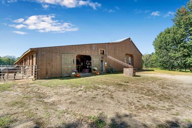Barn with attached indoor riding arena