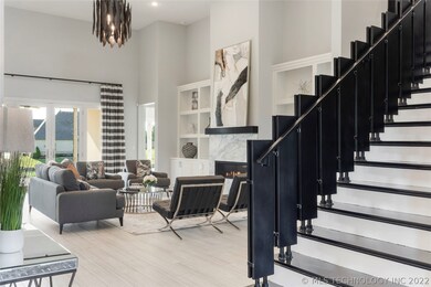 CUSTOM IRON STAIRCASE AND OPEN GREAT ROOM