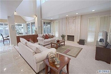Formal Step Down Living Area with Fireplace & Soar