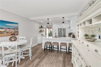 Kitchen with open shelves, stainless steel fridge