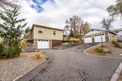 View of home exterior and additional 2 car garage