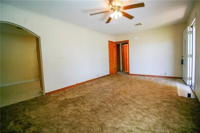 Living room with kitchen entrance