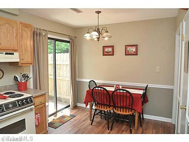 Kitchen. Step out to your patio from the kitchen...an instant addition to your entertaining space!