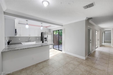 Kitchen featuring appliances with stainless steel