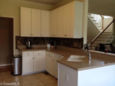 Kitchen. Open to the den is the large kitchen with tons of storage and solid surface counter tops.