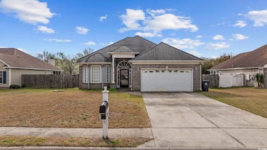 View of front of home featuring a front lawn, driv