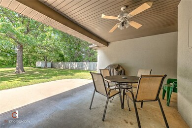 Nice covered deck with a fan in this Covered patio
