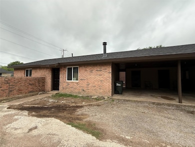 View of side of property with roof with shingles,