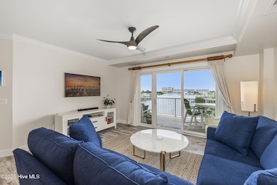Living room with covered balcony access