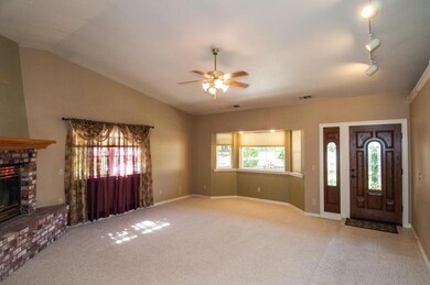 Cozy living room with brick fireplace!