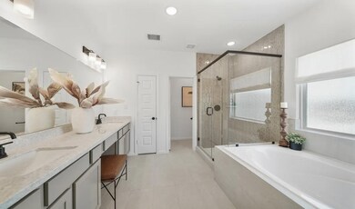 Primary bath with glass shower enclosure