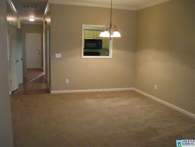 VIEW LOOKING TOWARD KITCHEN PASS THRU AND ENTRY HA