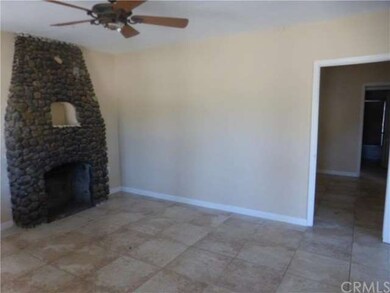Front Room with Fireplace and Ceiling Fan