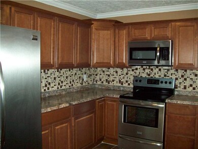 Open floorplan. New cabinets, tile backsplash and 