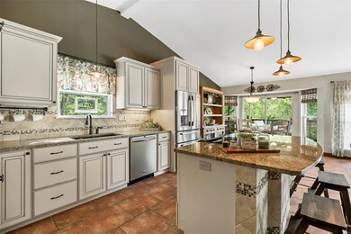 The tumbled stone backsplash and tile front breakf