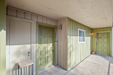 Property entrance with board and batten siding