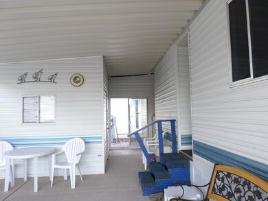 SLIDERS IN CARPORT TO BACK AREA