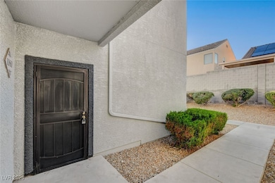 View of exterior entry featuring stucco siding