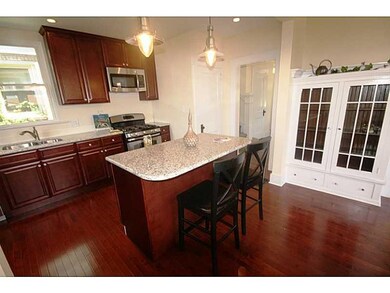 Kitchen. Another kitchen view. Nice dark cherry ca