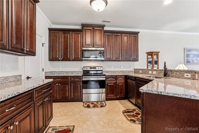 Spacious kitchen with granite counters, tile floor