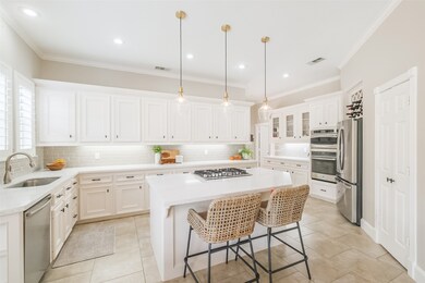 The beautifully updated kitchen featuring quartz countertops.