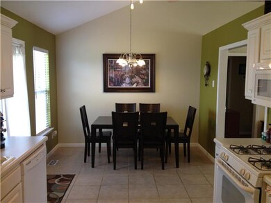 Breakfast area is large and has vaulted ceiling.
