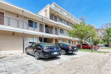 View of building exterior featuring uncovered par