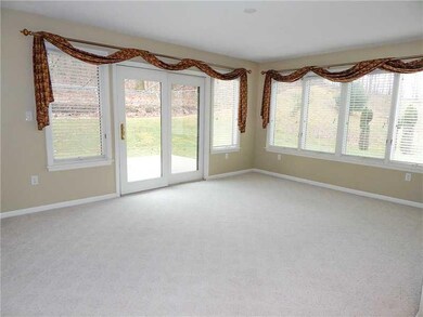 Living Room. The living room/sunroom is light and 