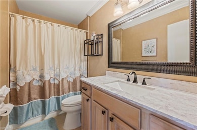 Bathroom with vanity, tile patterned flooring, and a shower with curtain